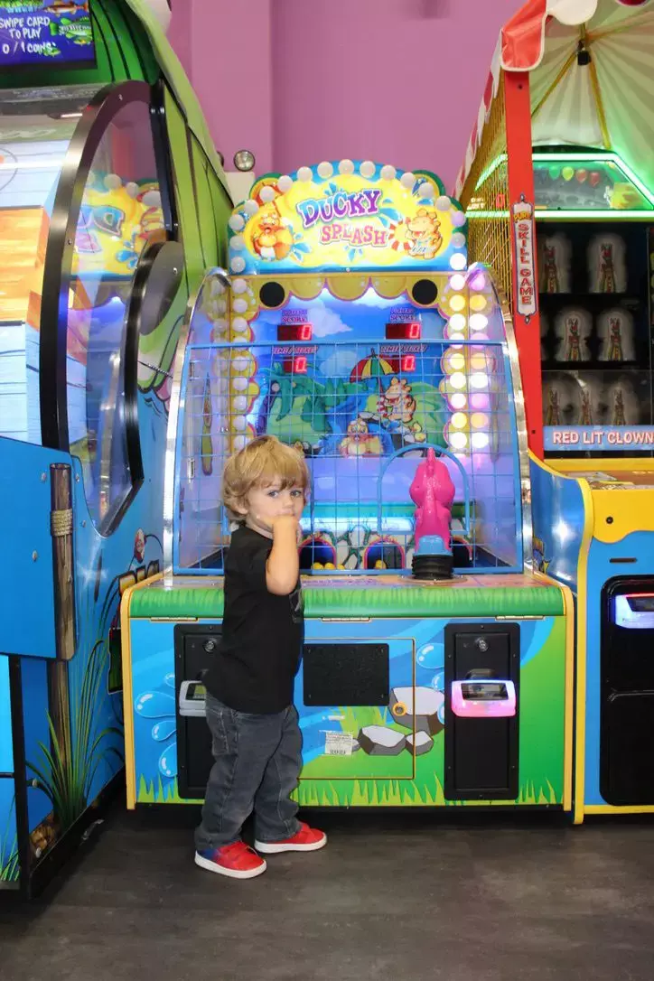 young boy playing Ducky Splash