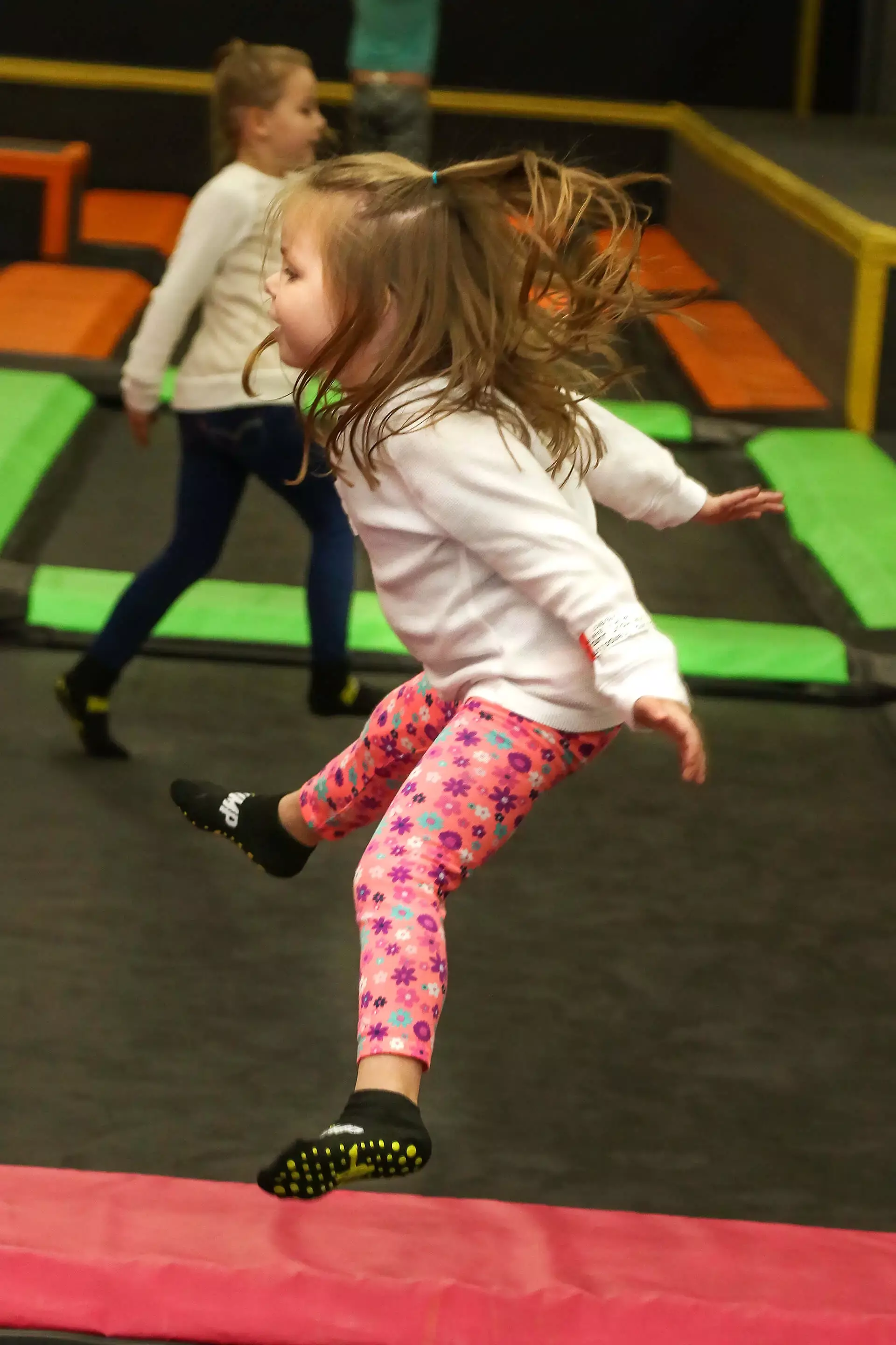 kids jumping on trampolines