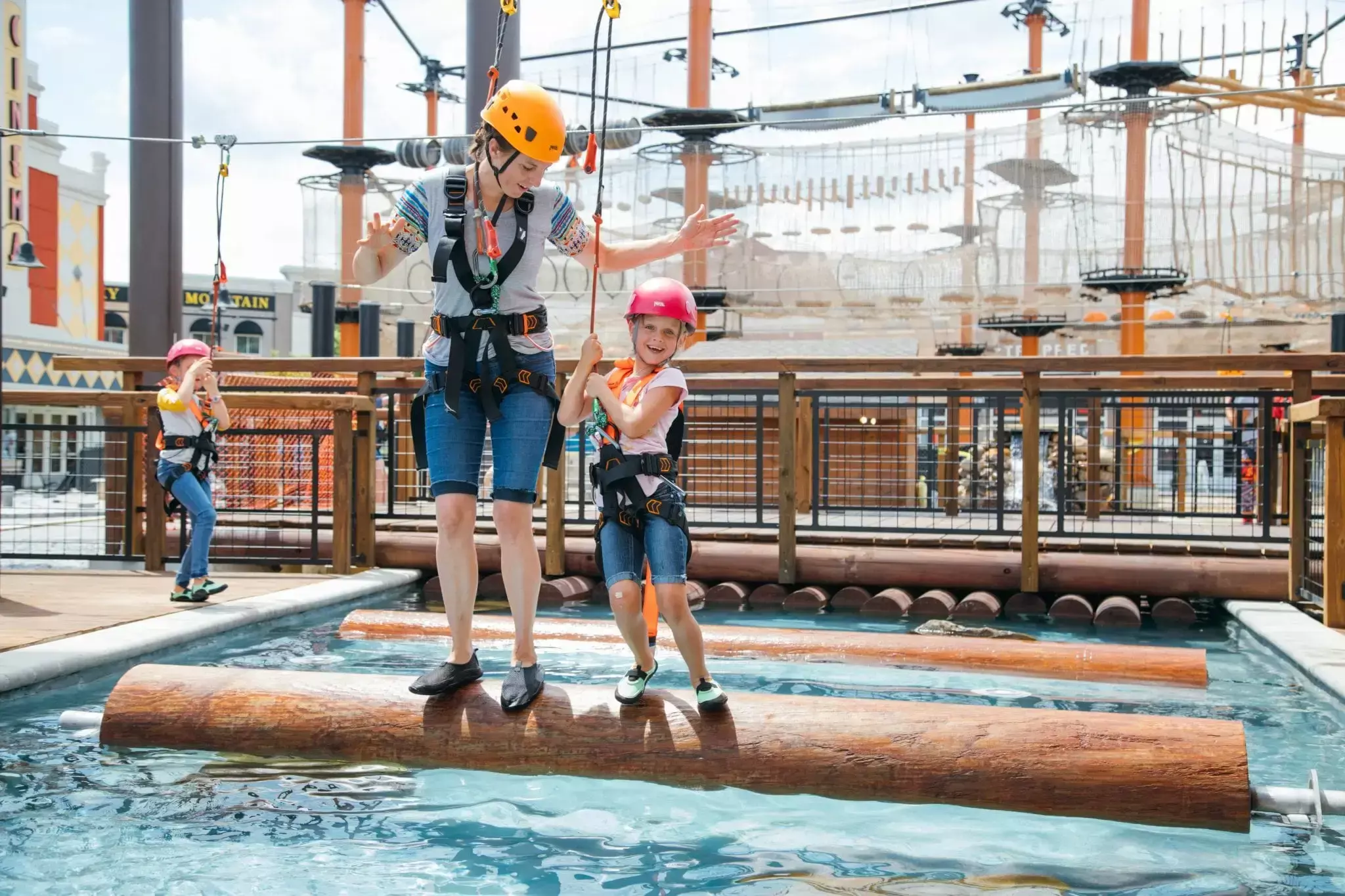 lumberjack-photo-kids-rolling-log-water-course